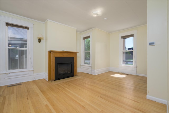 522 Hickory St, Anaconda, MT 59711 - unfurnished living room with wood finished floors, ornamental molding, and a fireplace with flush hearth
