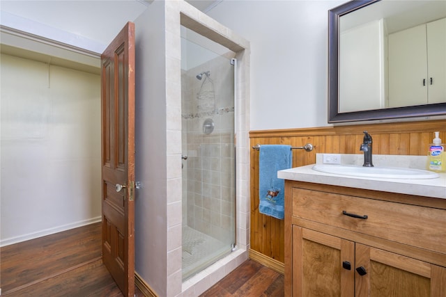 522 Hickory St, Anaconda, MT 59711 - full bathroom with a stall shower, wood finished floors, and vanity