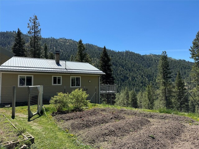 rear view of house with a mountain view