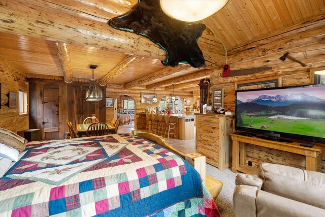 carpeted bedroom featuring lofted ceiling with beams, wooden ceiling, and log walls