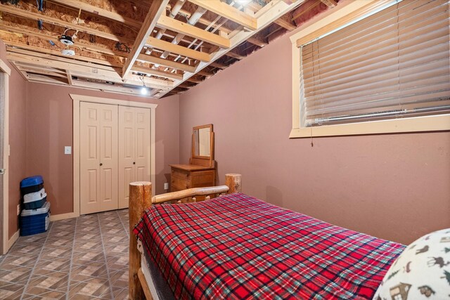 bedroom with a closet and baseboards