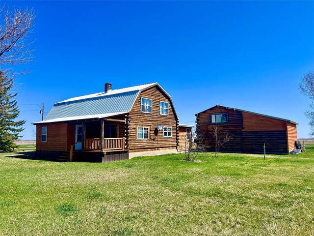630 18th Rd NW, Choteau, MT 59422 - rear view of property featuring a gambrel roof, metal roof, and a lawn