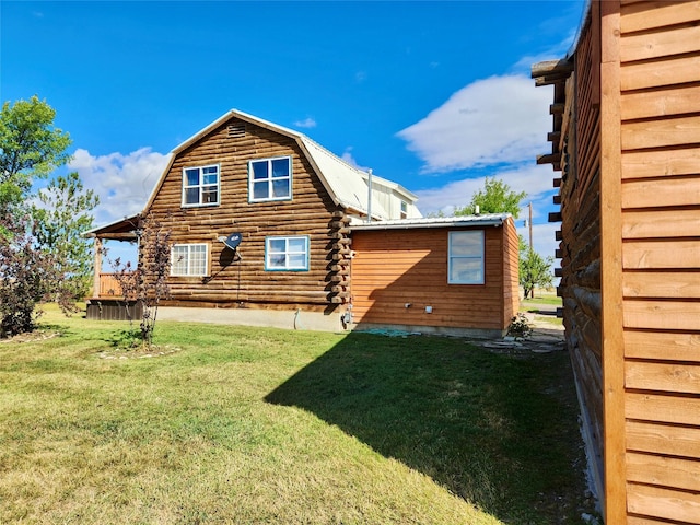 630 18th Rd NW, Choteau, MT 59422 - rear view of property featuring a gambrel roof, log exterior, metal roof, and a lawn