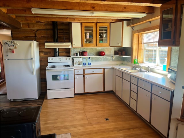 630 18th Rd NW, Choteau, MT 59422 - kitchen with under cabinet range hood, a sink, light countertops, and white appliances