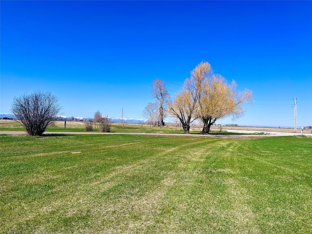 630 18th Rd NW, Choteau, MT 59422 - view of home's community with a rural view and a lawn