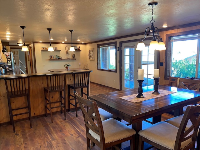 102 W Clark St, Philipsburg, MT 59858 - dining room featuring an inviting chandelier, crown molding, and dark wood-style floors