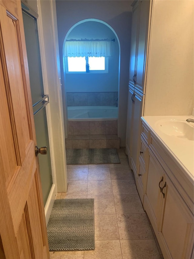 102 W Clark St, Philipsburg, MT 59858 - full bathroom featuring tile patterned flooring, tiled bath, vanity, and an enclosed shower