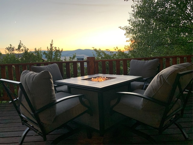 102 W Clark St, Philipsburg, MT 59858 - balcony at dusk with a fire pit and a deck with mountain view