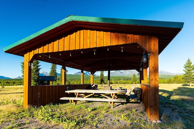 400 Kintla Ranch Rd, Polebridge, MT 59928 - view of yard with a mountain view, a gazebo, and a detached carport