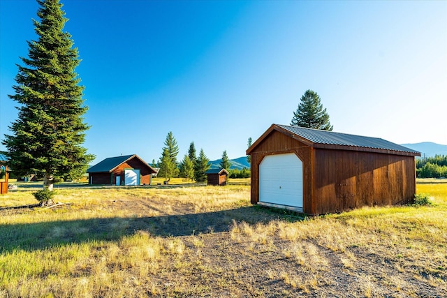 400 Kintla Ranch Rd, Polebridge, MT 59928 - view of yard featuring an outdoor structure and a garage