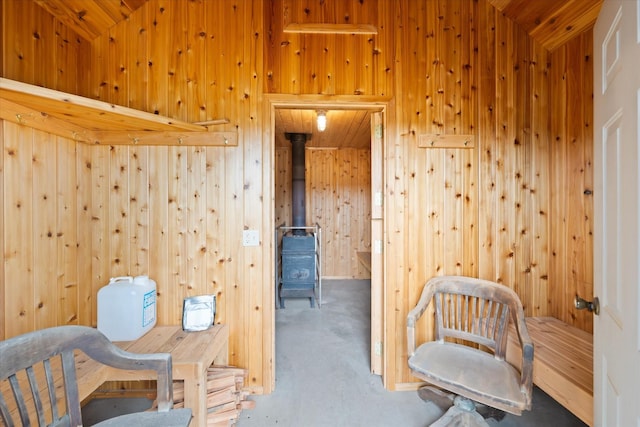 400 Kintla Ranch Rd, Polebridge, MT 59928 - sitting room featuring wooden walls and a wood stove