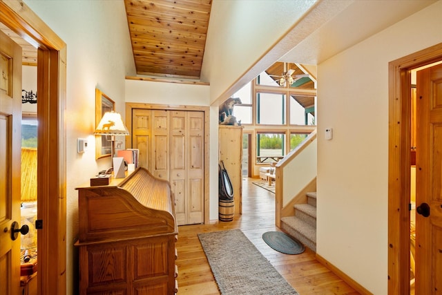 400 Kintla Ranch Rd, Polebridge, MT 59928 - entrance foyer with a ceiling fan, high vaulted ceiling, stairs, light wood-type flooring, and wood ceiling