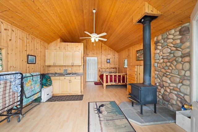 400 Kintla Ranch Rd, Polebridge, MT 59928 - kitchen with vaulted ceiling, light wood-style floors, ceiling fan, wooden ceiling, and wood walls