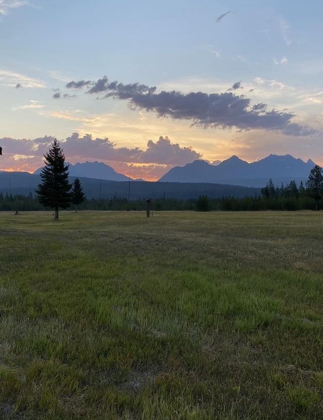 400 Kintla Ranch Rd, Polebridge, MT 59928 - view of mountain backdrop featuring rural landscape