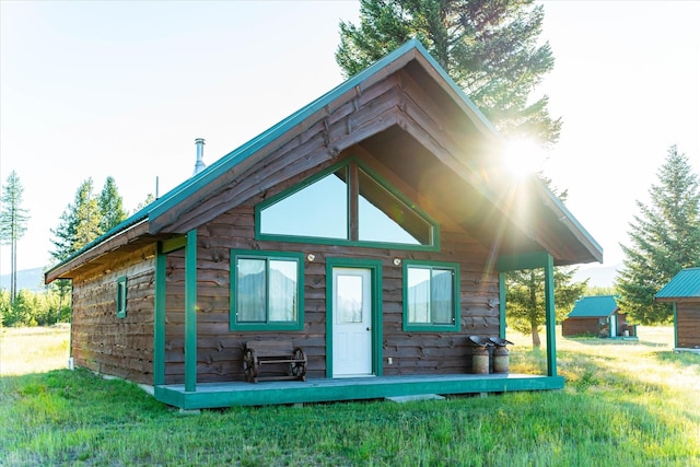 400 Kintla Ranch Rd, Polebridge, MT 59928 - rear view of house with a yard