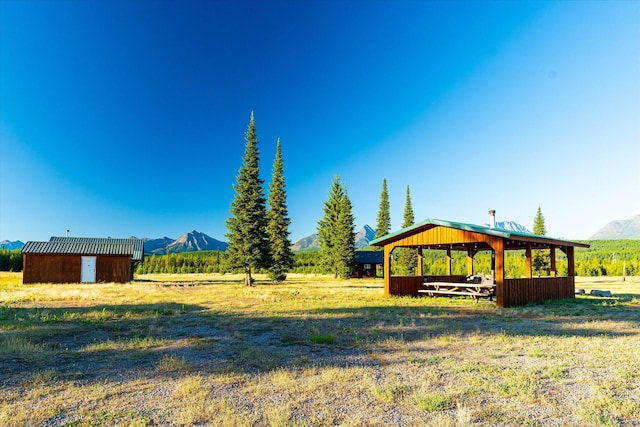 400 Kintla Ranch Rd, Polebridge, MT 59928 - view of yard featuring a mountain view and a view of countryside