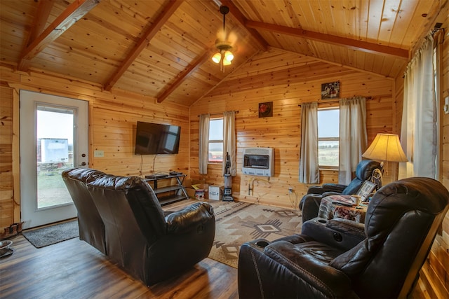 living room featuring heating unit, wood walls, wood ceiling, lofted ceiling with beams, and hardwood / wood-style floors