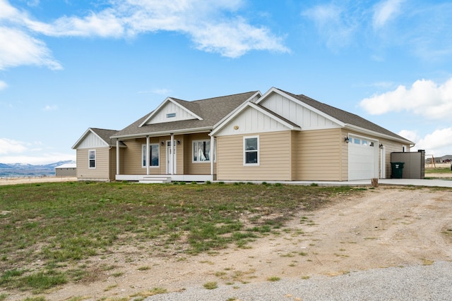 view of front of house featuring a front yard and a garage