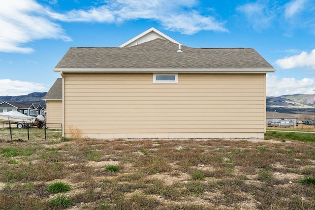 view of property exterior with a mountain view