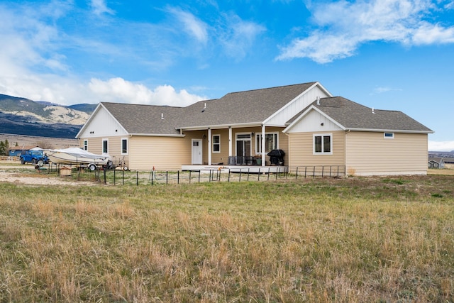 back of property with a mountain view