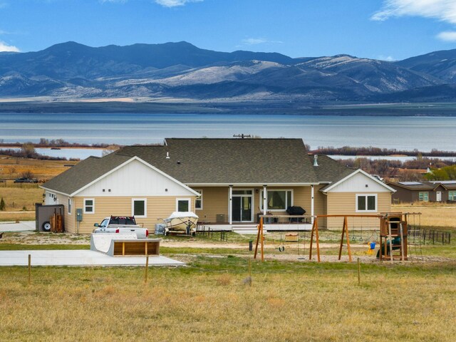 rear view of house featuring a mountain view