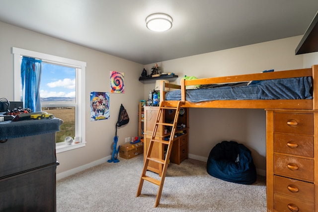 bedroom featuring light carpet and multiple windows