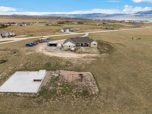 drone / aerial view with a rural view and a mountain view