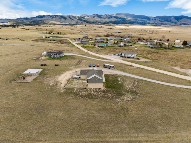 drone / aerial view with a mountain view and a rural view