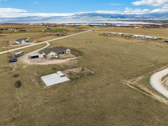 drone / aerial view with a mountain view and a rural view