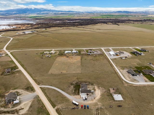 birds eye view of property featuring a mountain view and a rural view