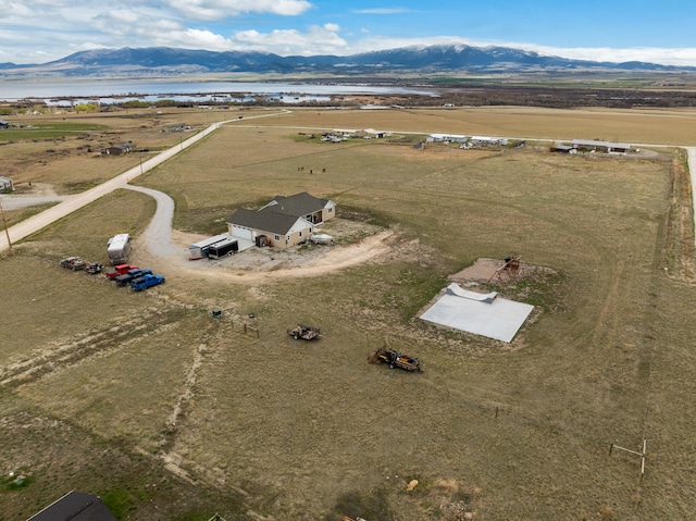 aerial view featuring a rural view and a water and mountain view