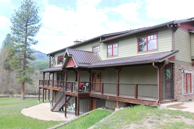 rear view of house with a yard