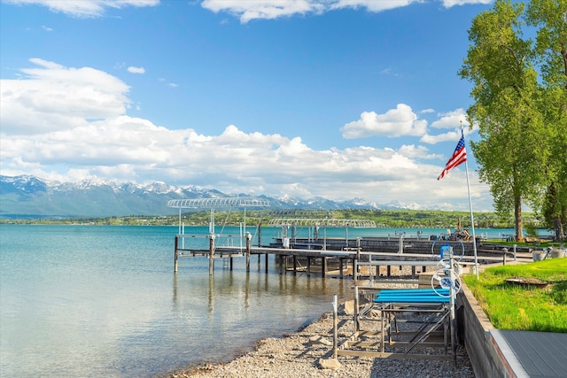 dock area featuring a water and mountain view