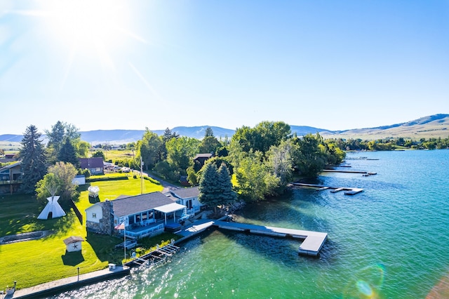 aerial view featuring a water and mountain view