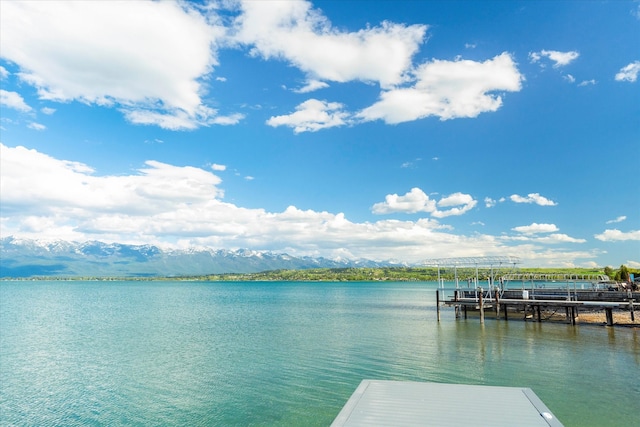 exterior space featuring a water and mountain view