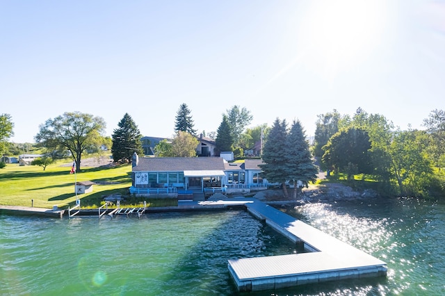 view of dock featuring a yard and a water view