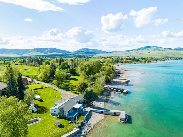 drone / aerial view with a water and mountain view