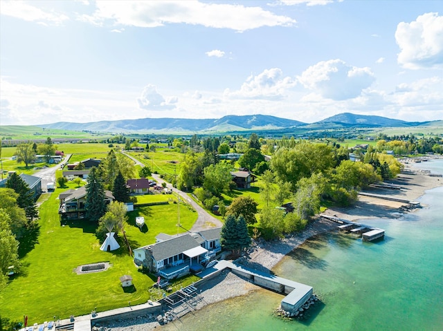 birds eye view of property featuring a water and mountain view