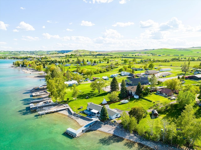 bird's eye view featuring a water view and a rural view