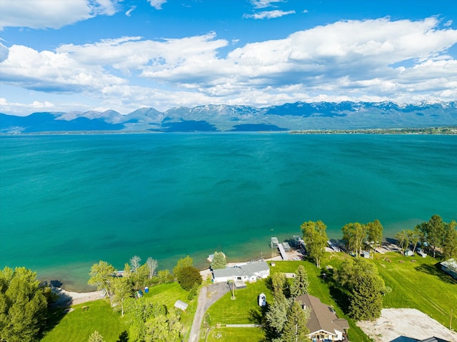 aerial view featuring a water and mountain view