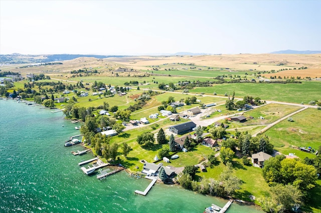 birds eye view of property featuring a water view and a rural view