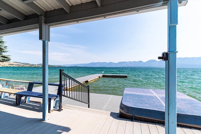 dock area featuring a water and mountain view