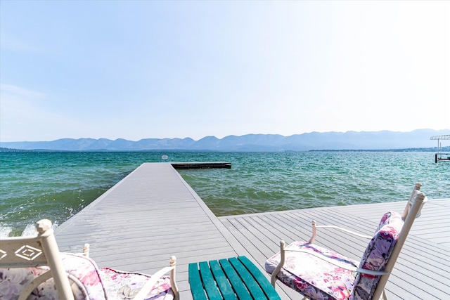 dock area featuring a water and mountain view