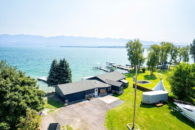 birds eye view of property featuring a water and mountain view