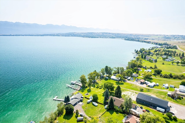 drone / aerial view with a water and mountain view