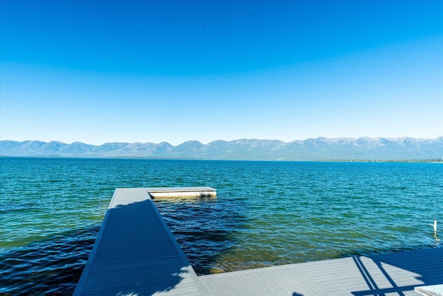 dock area featuring a water and mountain view