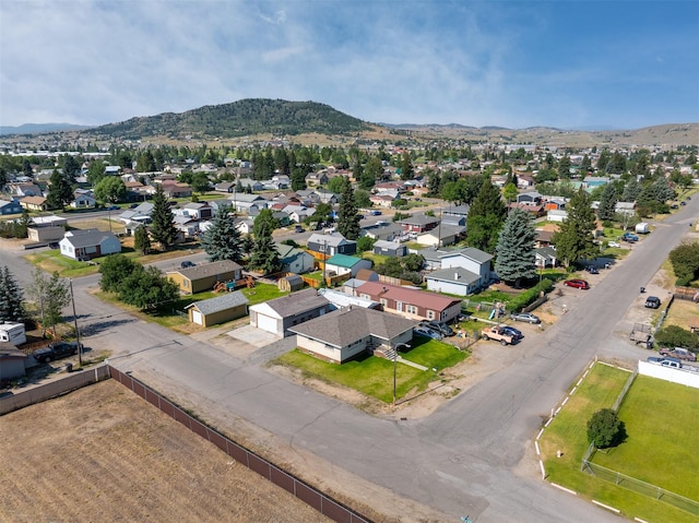 birds eye view of property with a mountain view