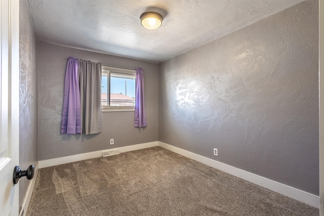 empty room featuring carpet floors