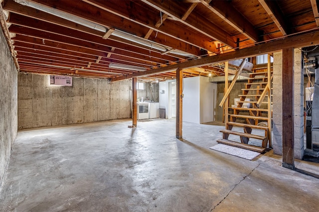 basement with washer and clothes dryer