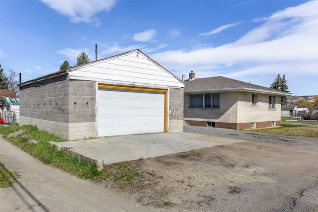 view of front of home with an outbuilding and a garage